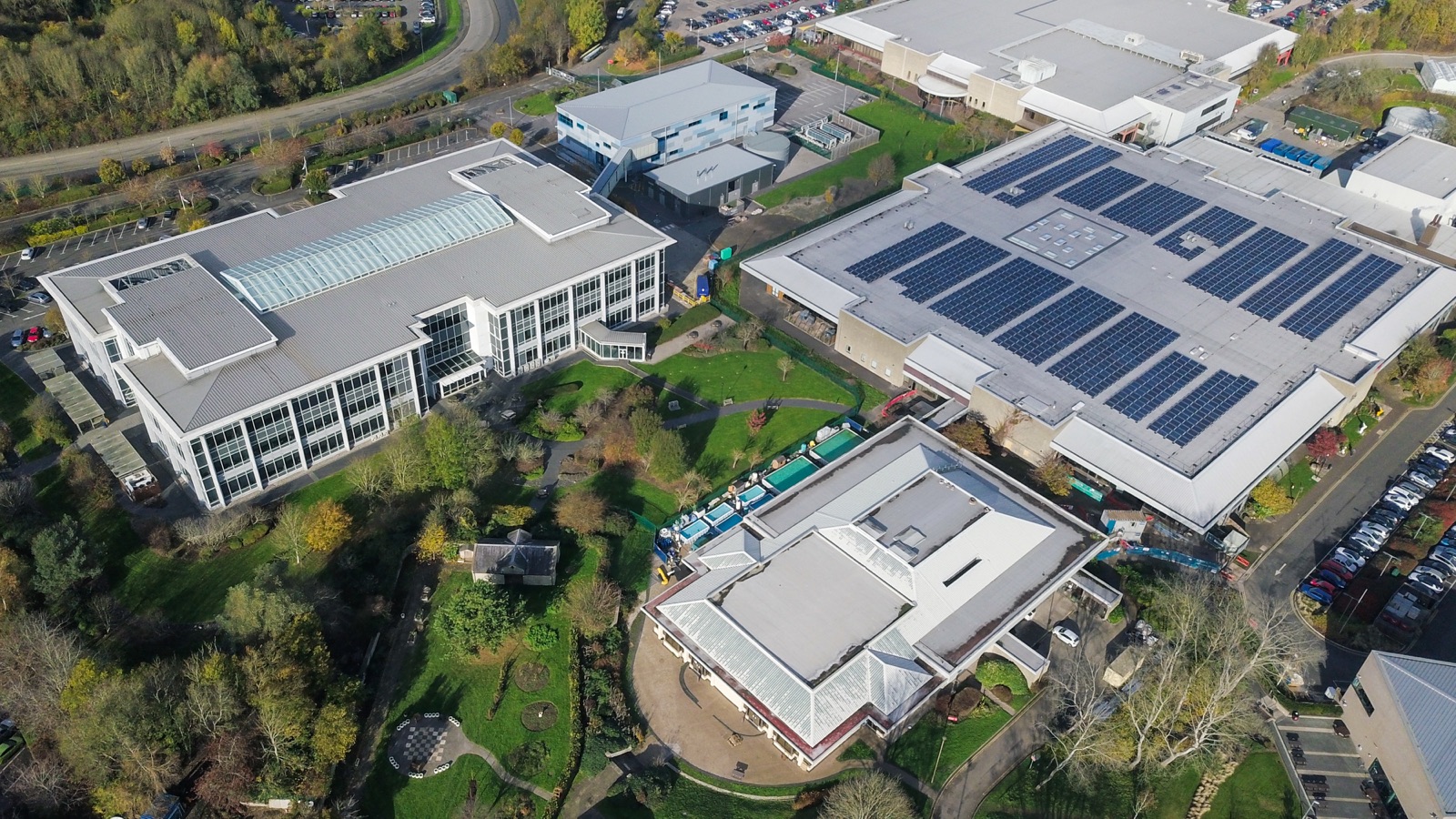 Aerial view of solar panels covering a large industrial roof